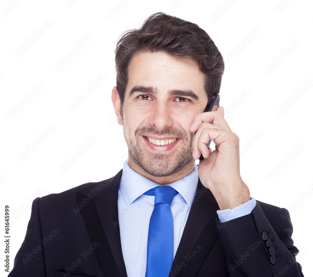 Handsome business man talking on the phone, isolated on a white