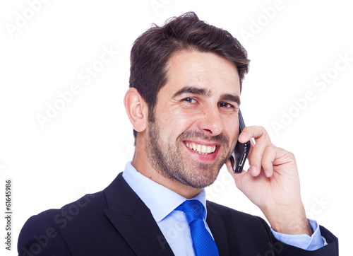 Handsome business man talking on the phone, isolated on a white