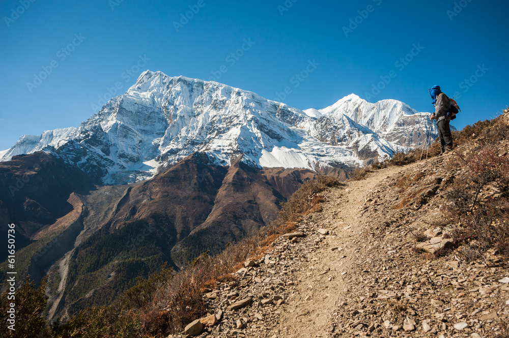 Trekker and Annapurna range, Himalayas of Nepal. Trekker and Annapurna range, Himalayas of Nepal.