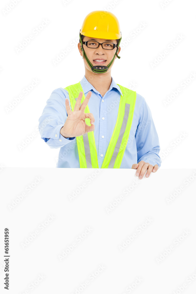 Happy architect make ok gesture and holding board Happy architect make ok gesture and holding board