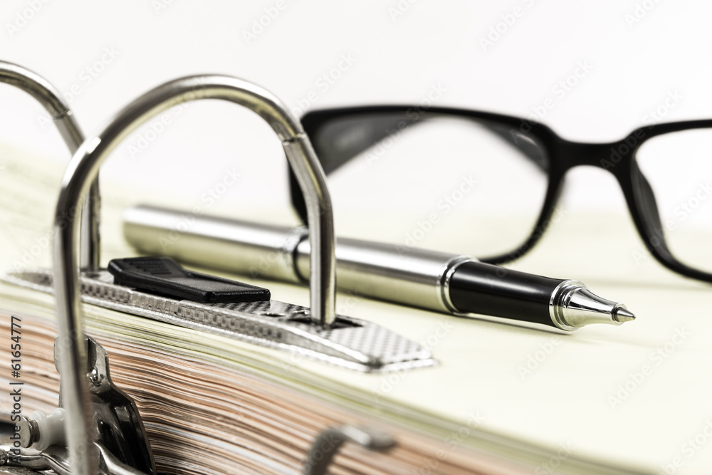 metall office binder close up with documents stacked metall office binder close up with documents stacked
