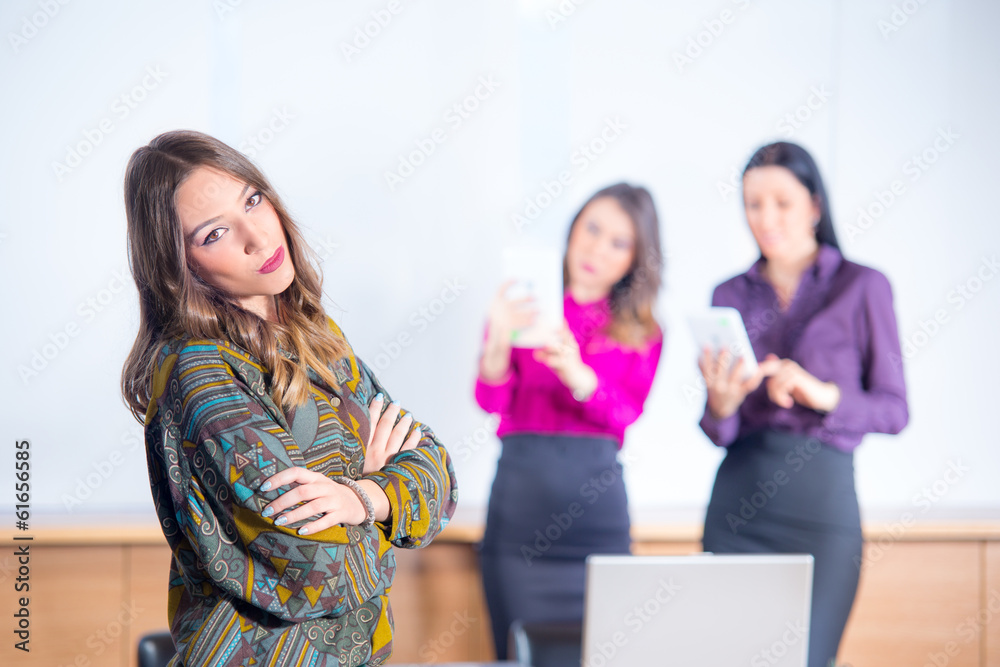 The beautiful business woman with a team on a back background