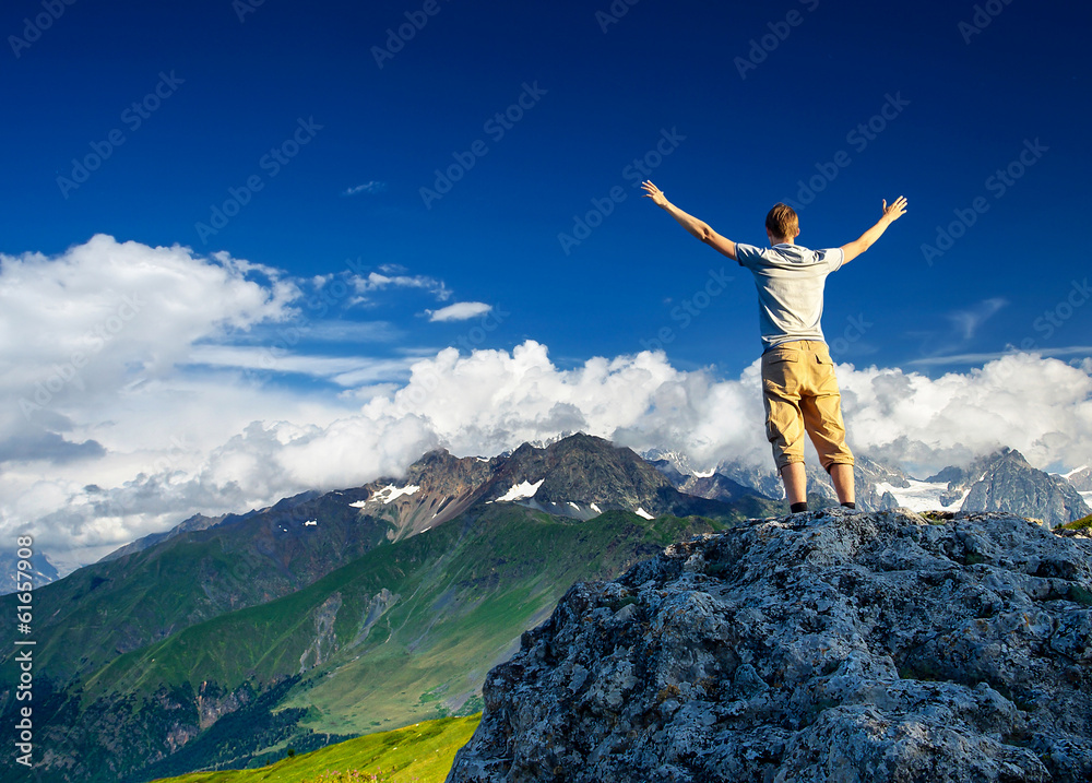 Tourist in mountains. Sport and active life concept Tourist in mountains. Sport and active life concept