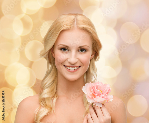 smiling woman with peony flower