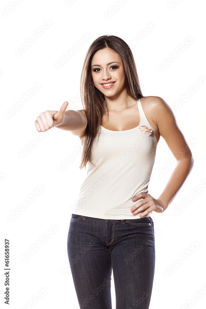 smiling young girl posing with a thumb up on white background smiling young girl posing with a thumb up on white background