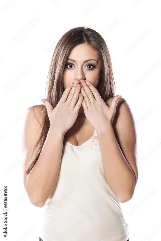Shocked girl covering her mouth with her palms Shocked girl covering her mouth with her palms