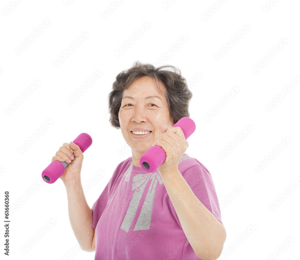 smiling senior woman working out with dumbbells smiling senior woman working out with dumbbells