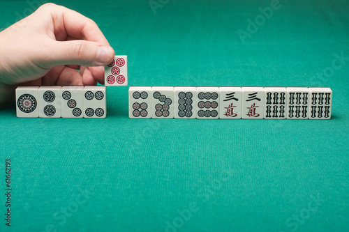 Smooth table surface with a mahjong on it