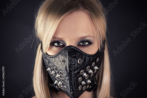 portrait of a woman in a mask with spikes