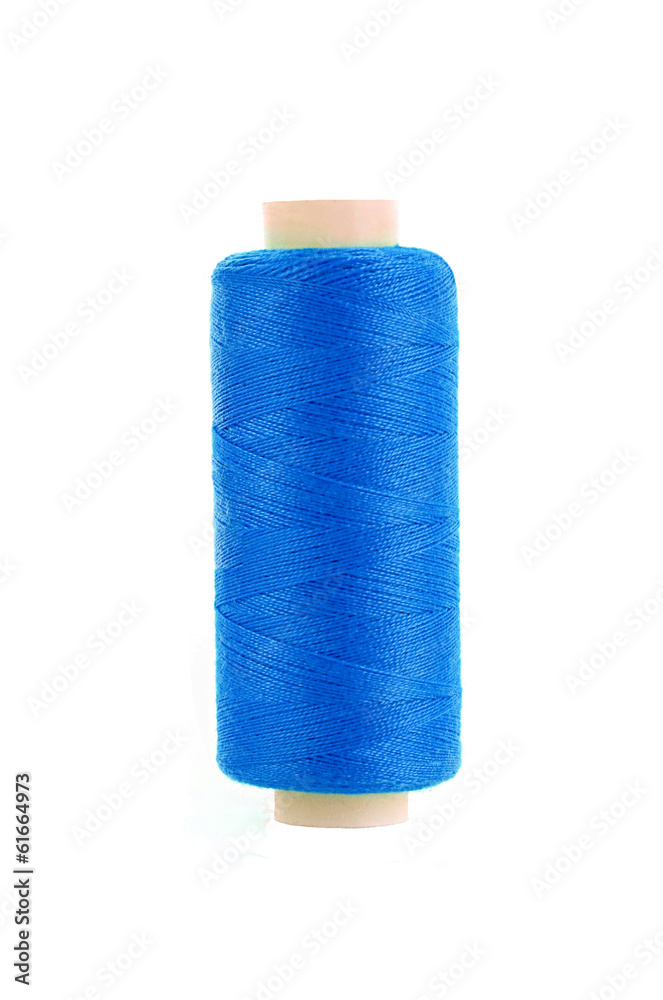 bobbin of blue thread isolated on the background bobbin of blue thread isolated on the background