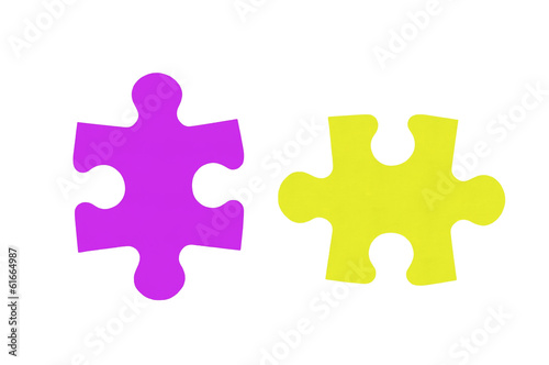 Colorful puzzles closeup isolated on white background