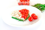 tomato and mushroom with rosemary on plate in the shape of heart