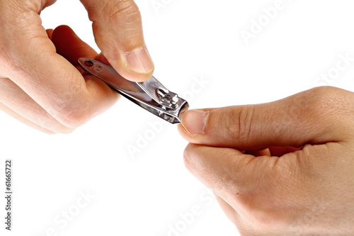 Hands using nail clipper