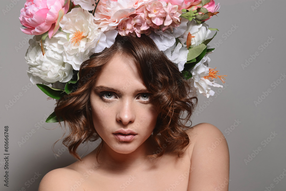 fashion model with large hairstyle and flowers in her hair fashion model with large hairstyle and flowers in her hair