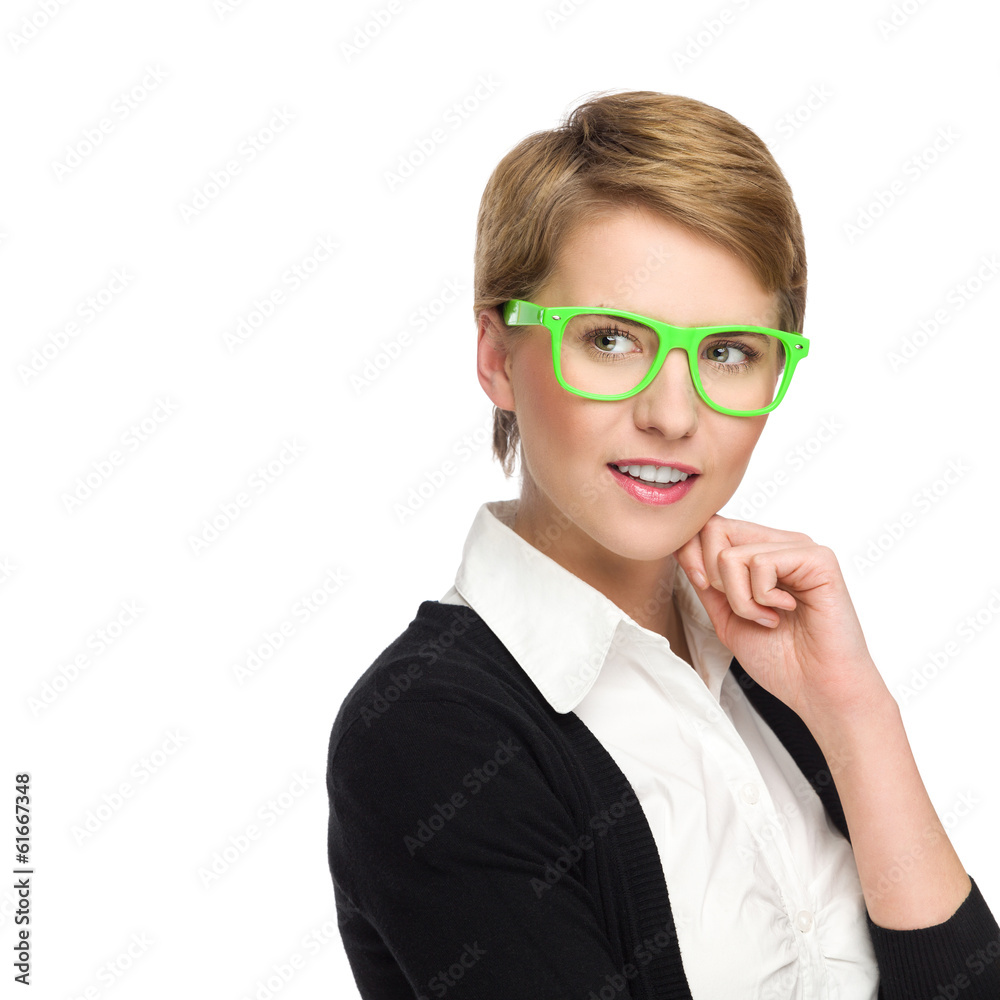 Beautiful young woman in green glasses looking at copy space.