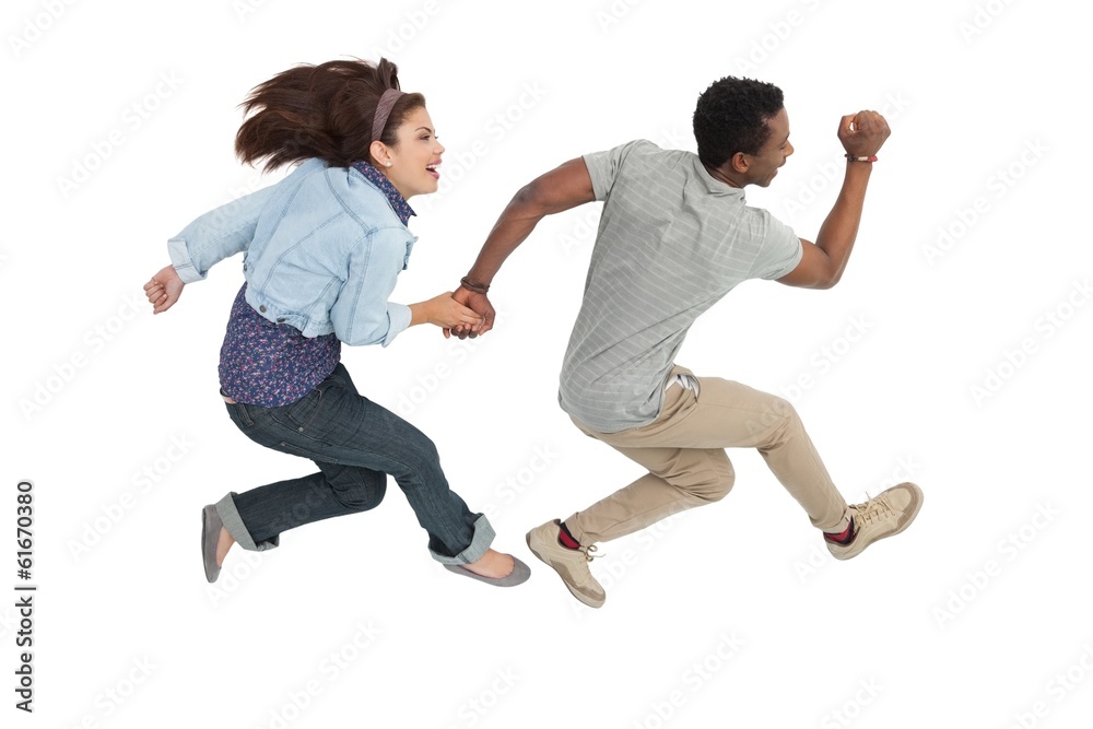 Side view of a cheerful couple jumping Side view of a cheerful couple jumping