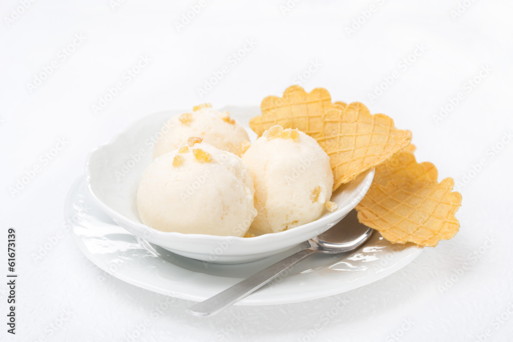 Ginger ice cream with melted milk, thin waffles in a bowl Ginger ice cream with melted milk, thin waffles in a bowl