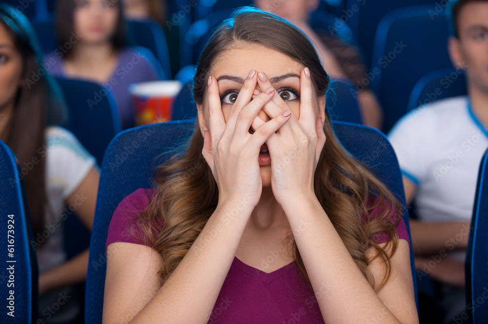 Naklejka premium Watching a scary movie.