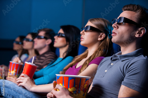 People enjoying three-dimensional movie.