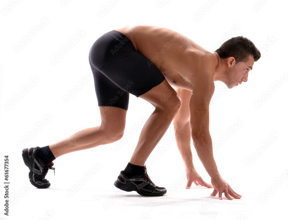 Atleta corredor en posición de partida. Atleta corredor en posición de partida.