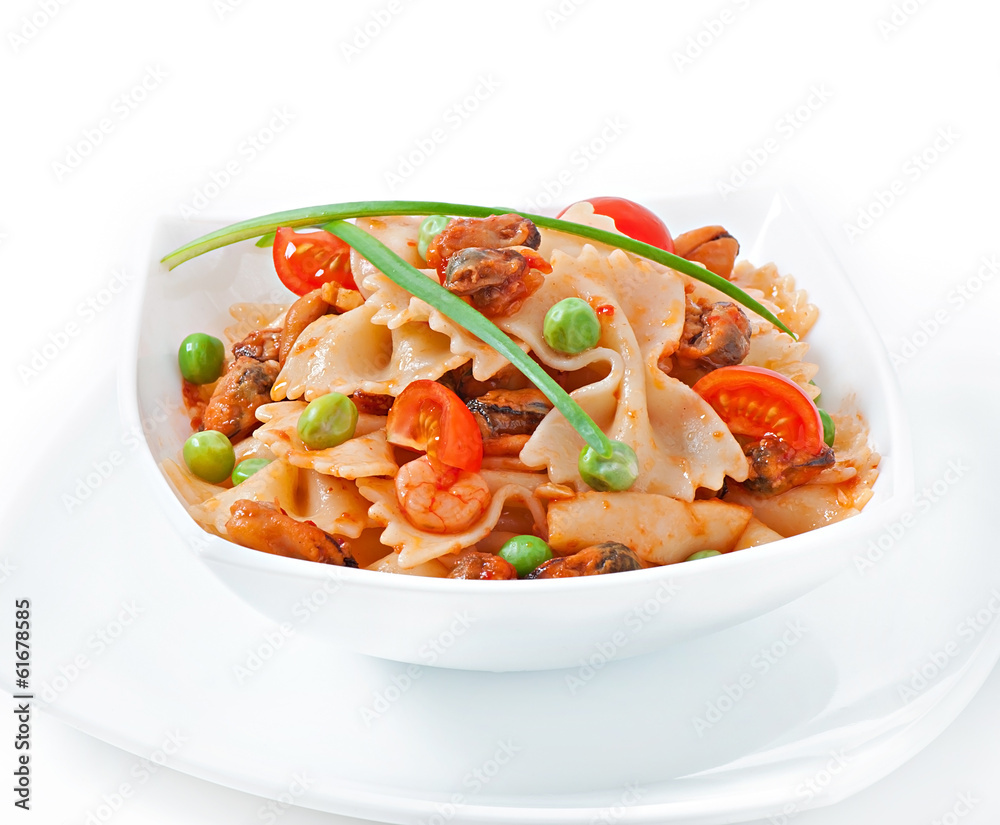 Farfalle pasta with seafood, cherry tomatoes and green peas Farfalle pasta with seafood, cherry tomatoes and green peas