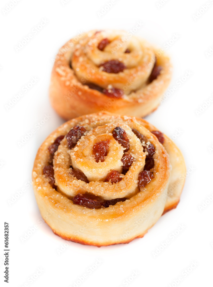 Two swirl buns with raisins and brown sugar Two swirl buns with raisins and brown sugar