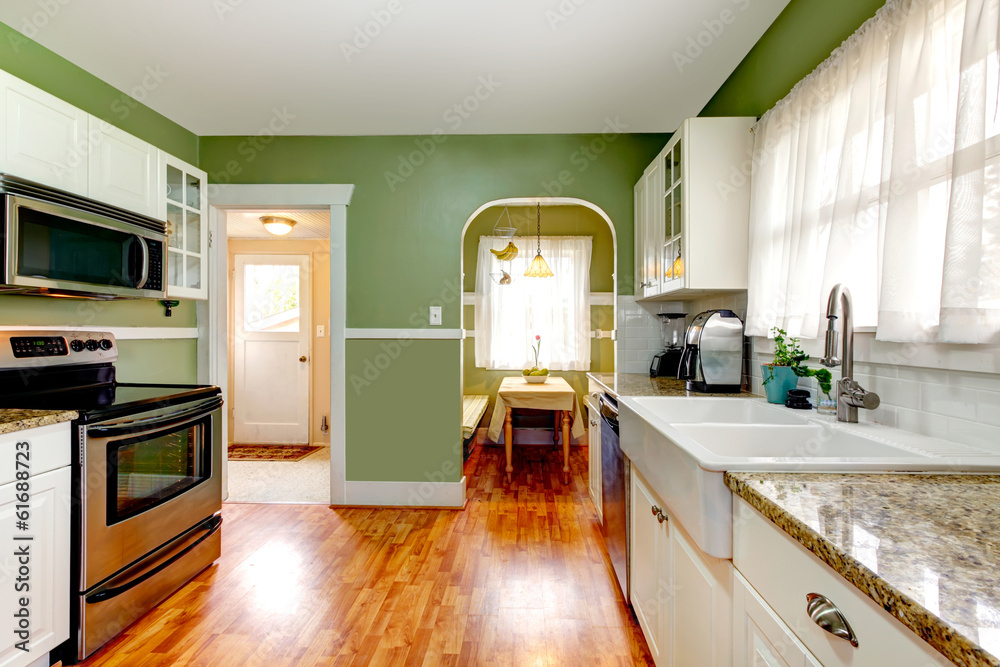Green kitchen room with dining area