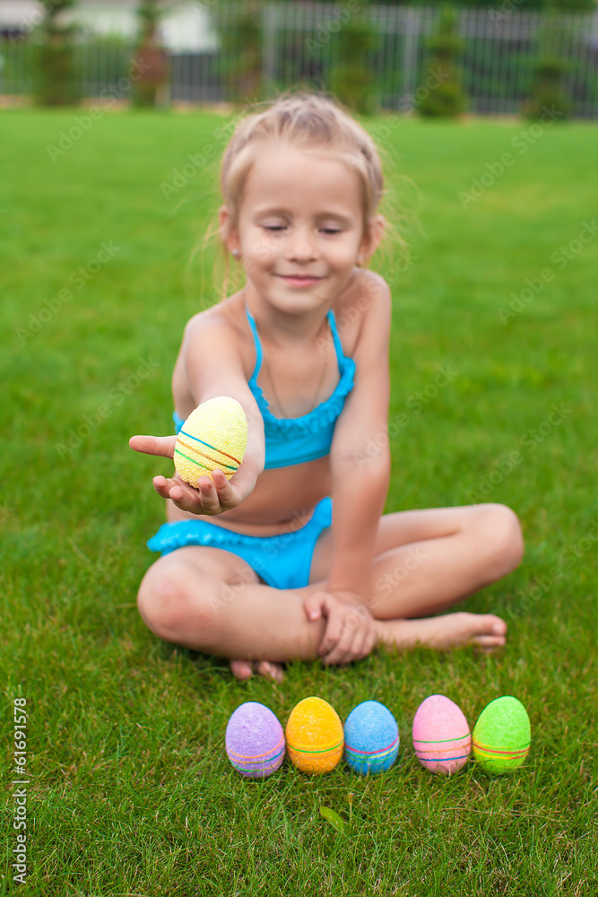Little beautiful girl holding an Easter egg Little beautiful girl holding an Easter egg