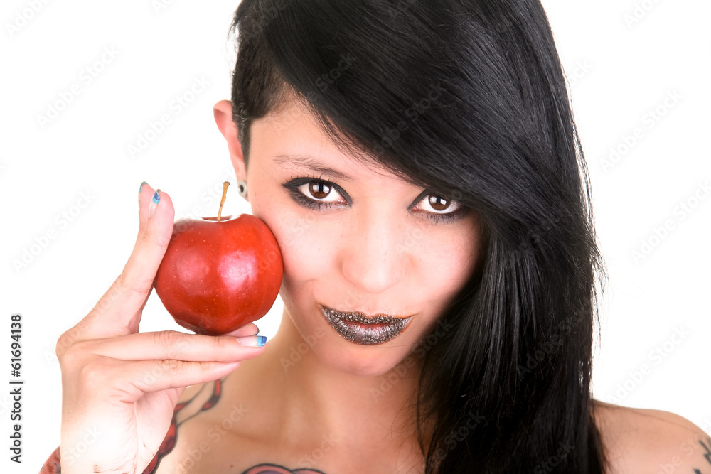 Portrait of caucasian young woman with apple and tattoos Portrait of caucasian young woman with apple and tattoos