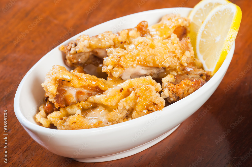 a bowl of lemon chicken a bowl of lemon chicken