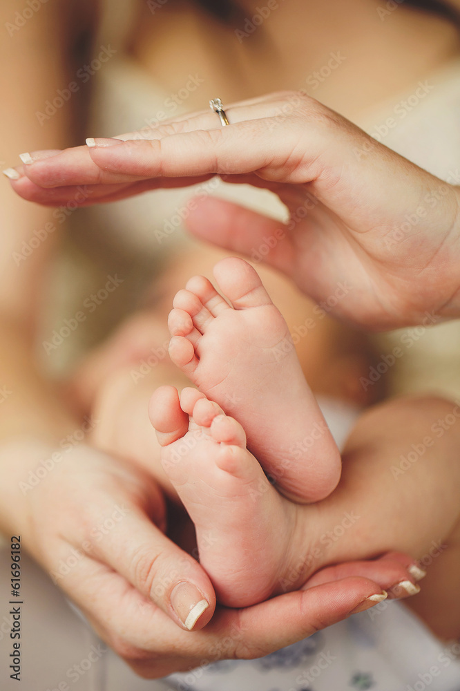 Baby legs. Legs newborn in parents hand. Infant feet. Baby legs. Legs newborn in parents hand. Infant feet.