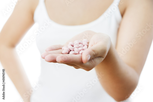 Pills in women hand