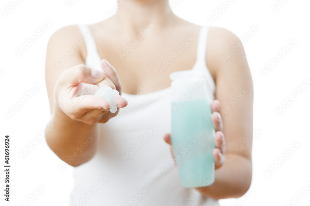 Bottle with cream in a female hand Bottle with cream in a female hand
