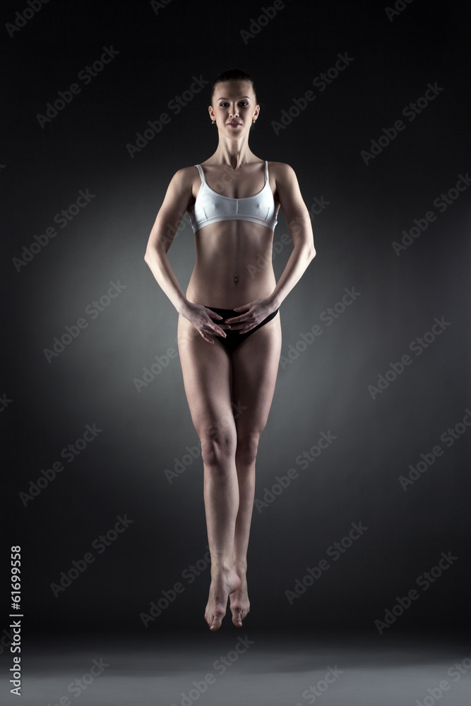 Image of beautiful slim dancer posing in jump Image of beautiful slim dancer posing in jump