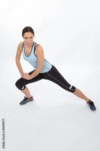 Young athlete doing lunge