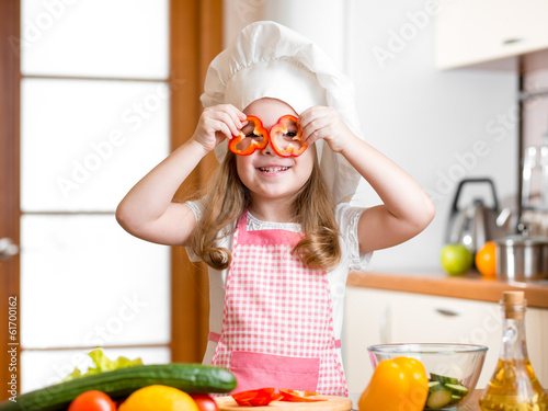 Funny chef girl cooking at ...