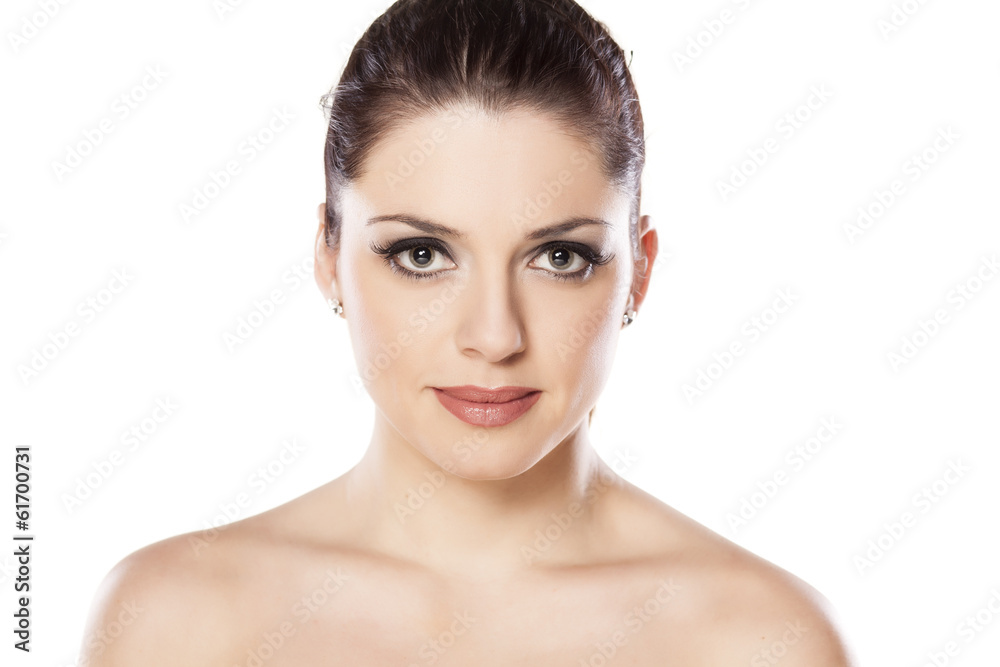 beautiful young woman posing on a white background