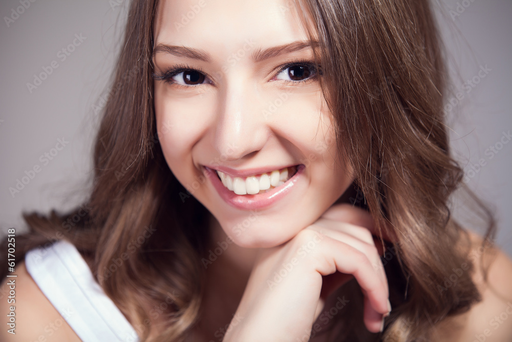 Portrait of beautiful woman over gray background Portrait of beautiful woman over gray background