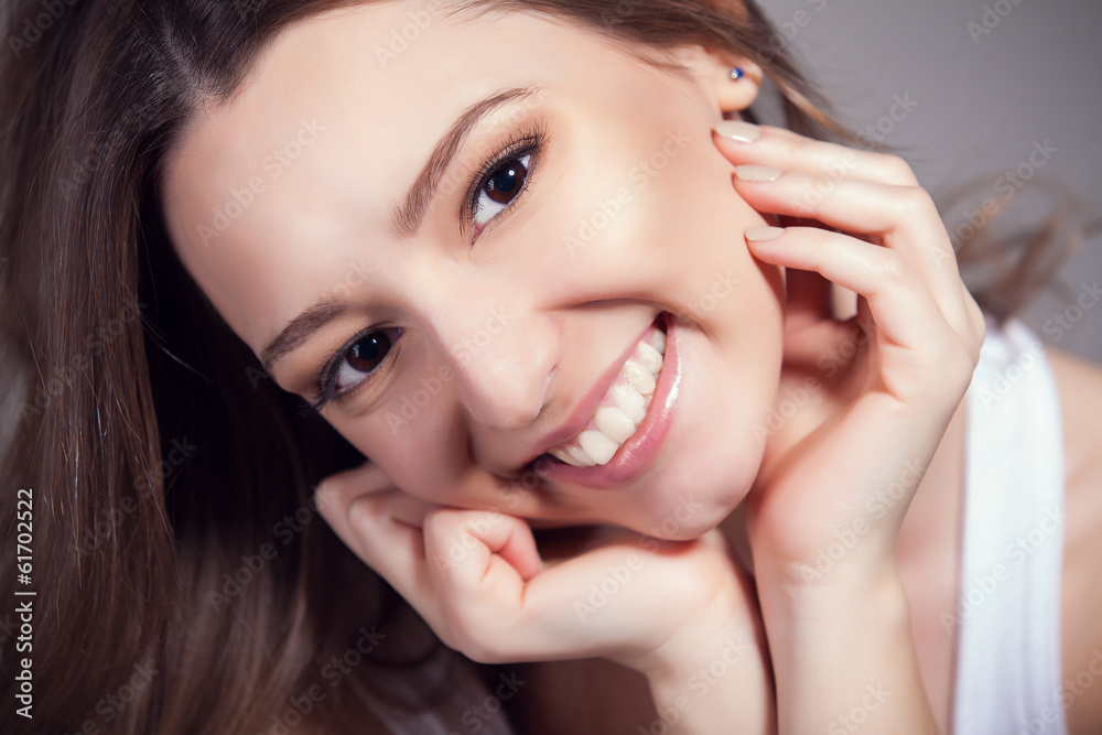 Portrait of beautiful woman over gray background Portrait of beautiful woman over gray background
