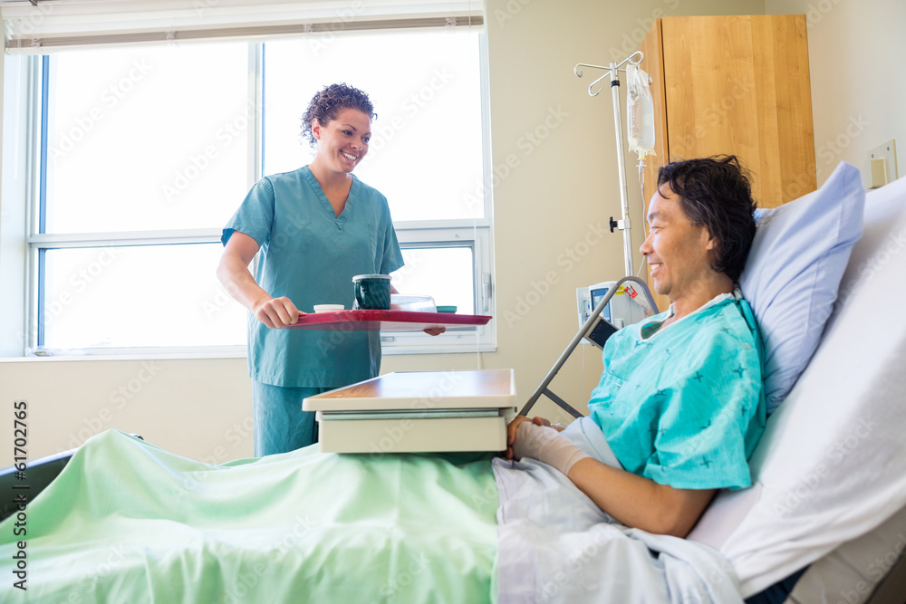 Fototapeta premium Nurse Bringing Breakfast For Patient In Hospital