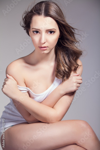 beautiful woman over gray background  head and shoulders