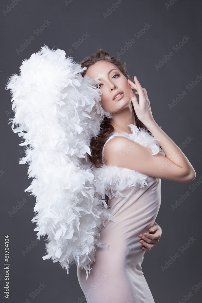 Image of beautiful woman posing with angel wings Image of beautiful woman posing with angel wings