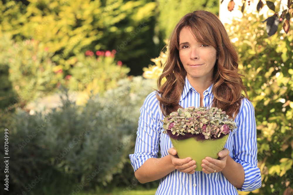 Beautiful mature woman gardening Beautiful mature woman gardening