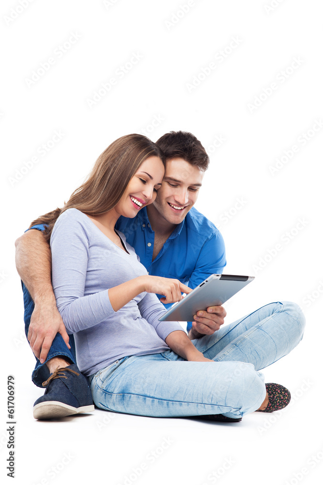 Couple using digital tablet