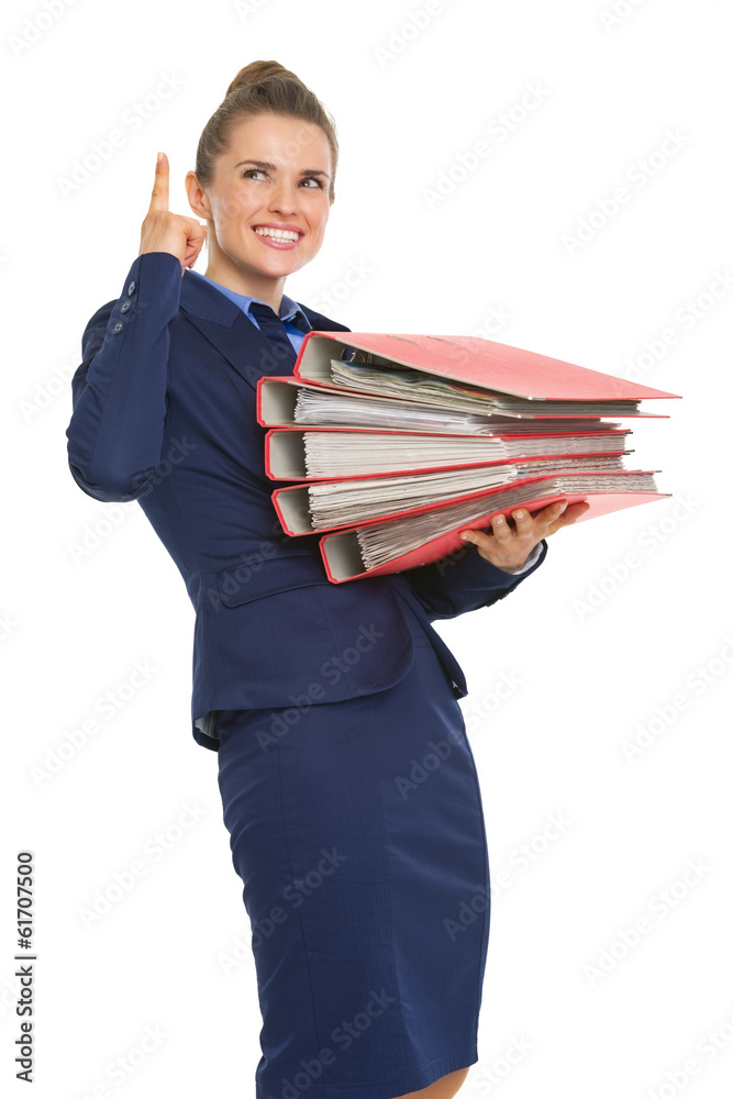 Business woman with stack of folders pointing on copy space Business woman with stack of folders pointing on copy space