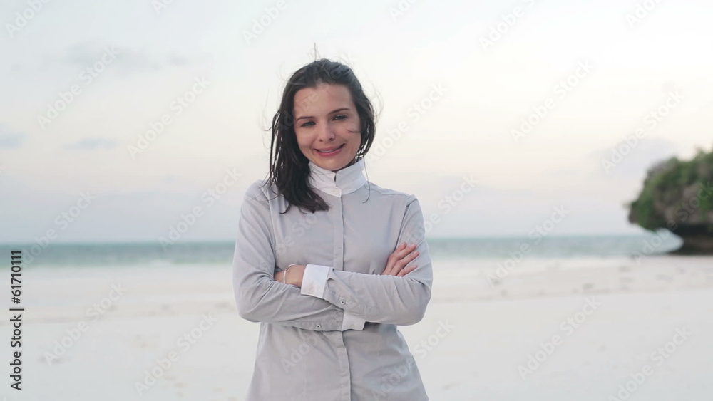 Happy confident businesswoman standing on exotic beach Happy confident businesswoman standing on exotic beach