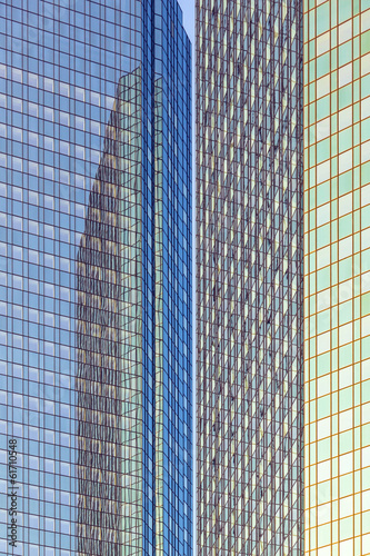 reflection of the sun in the facade of a skyscraper