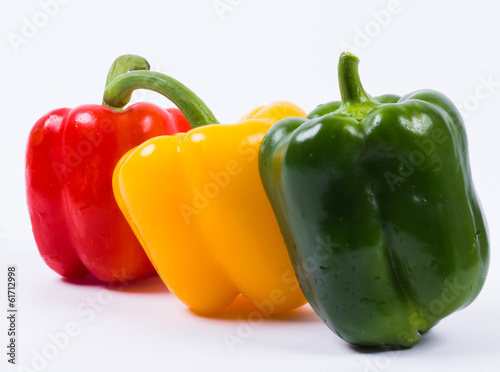Colour peppers on white background