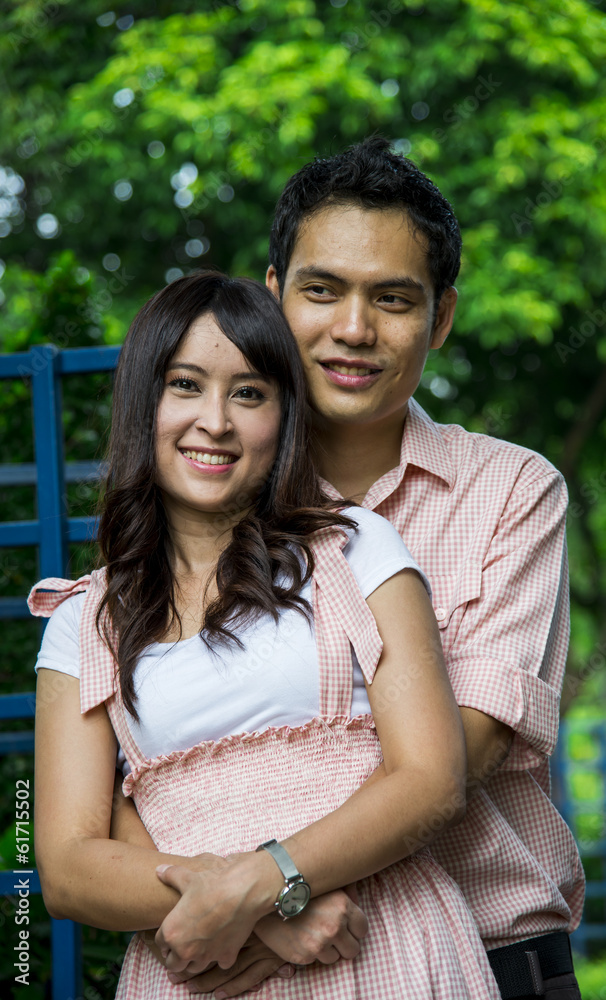 Naklejka premium Lover couple hug in the garden2