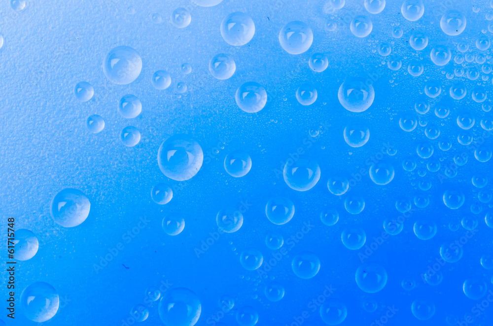 Water drop on color background